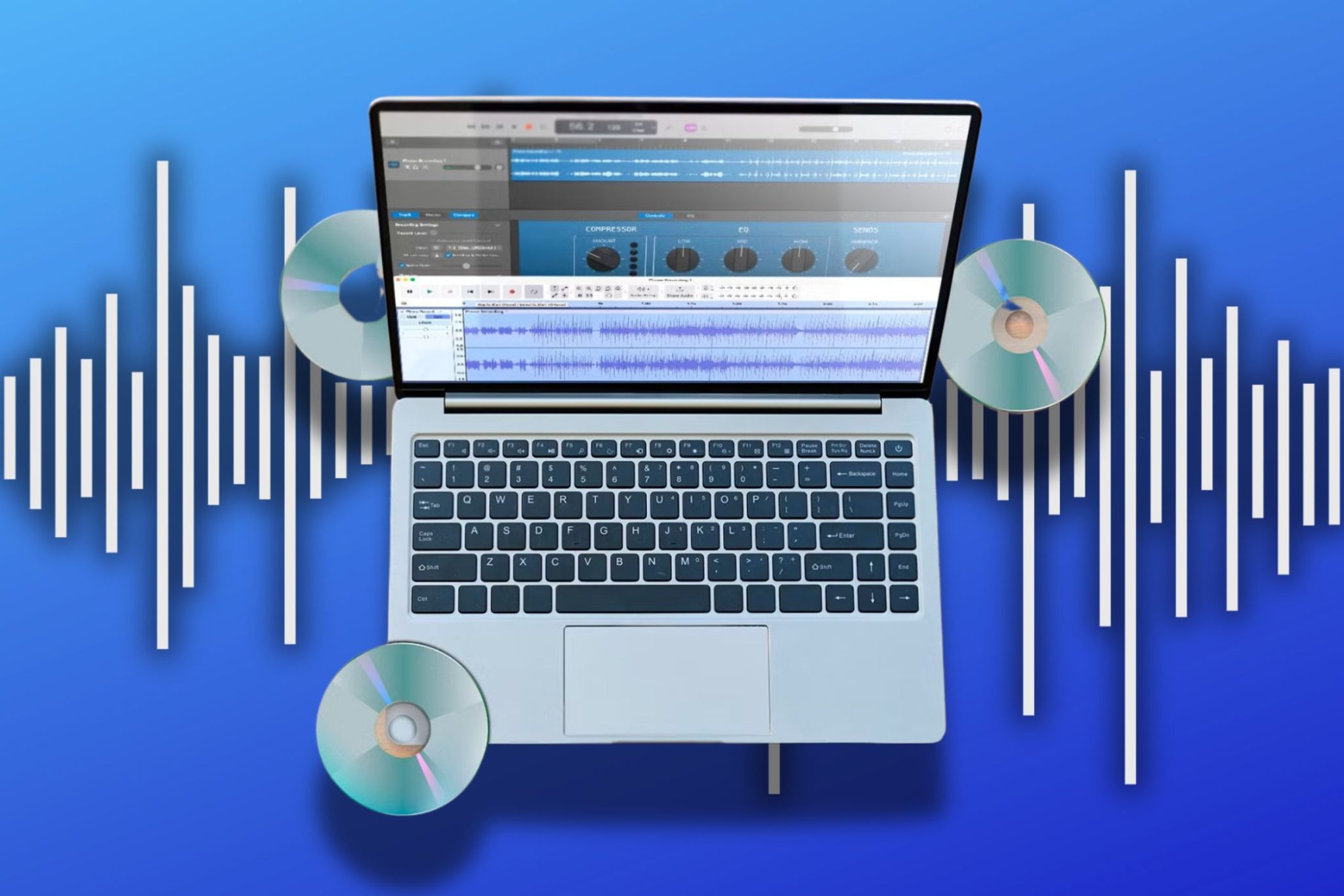 A laptop showing audio editor with CDs and audio wave in background