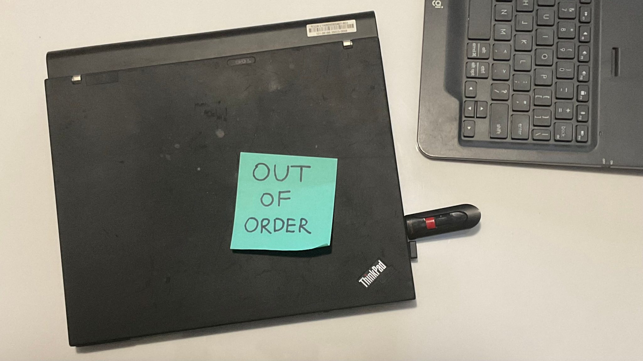 laptop is broken with post it note