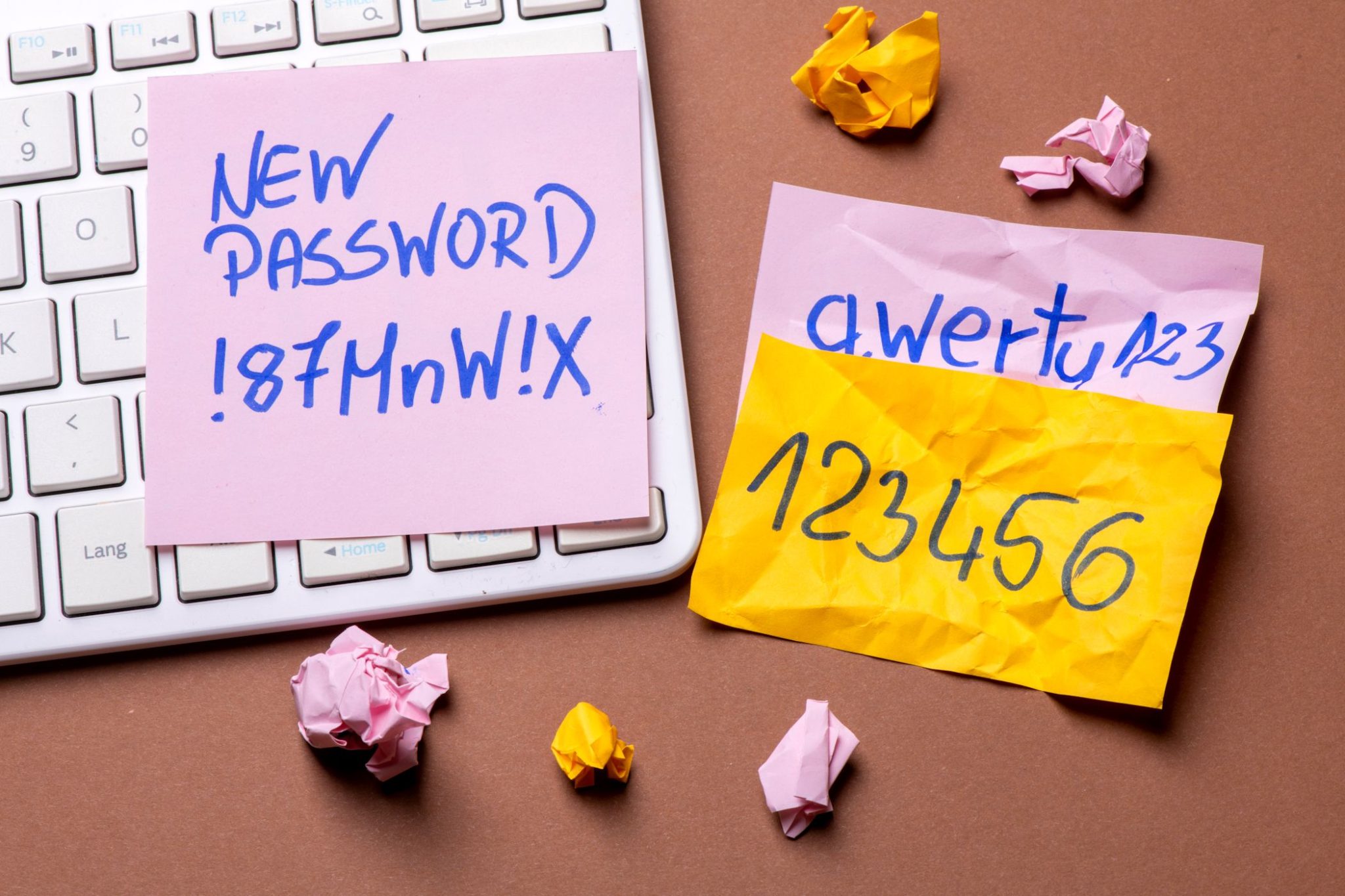 passwords written on post it notes next to keyboard